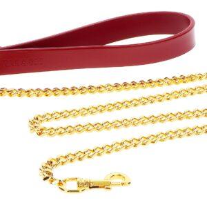 Taboom plomo de metal dorado con mango rojo 75cm
